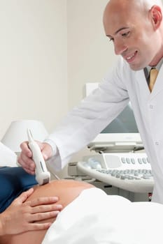 Pregnant woman going through an ultrasound scan