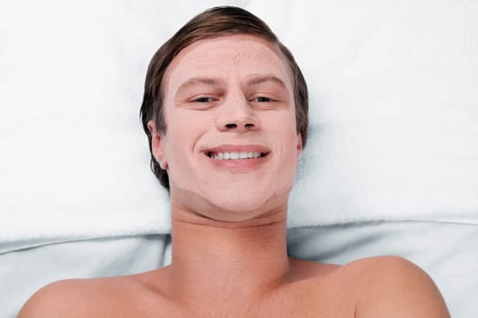 Man with face pack on his face