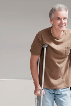 Patient walking with the help of crutches