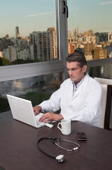 Doctor working on a laptop