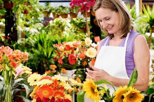 Female florist holding pruning shears