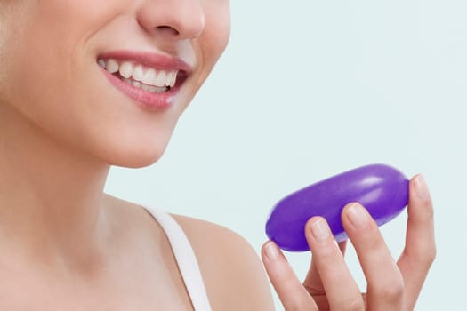 Close_up of a woman holding a bar of soap