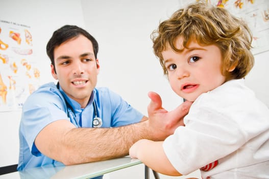 Doctor examining a baby boy