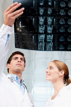 Doctor and a female nurse examining an x_ray report