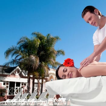 Woman receiving back massage from a massage therapist
