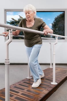 Disabled woman practicing on a walker