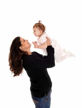 A mother lifting up her daughter baby, standing isolated for white.background..