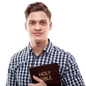 Young handsome happy man holding a Bible