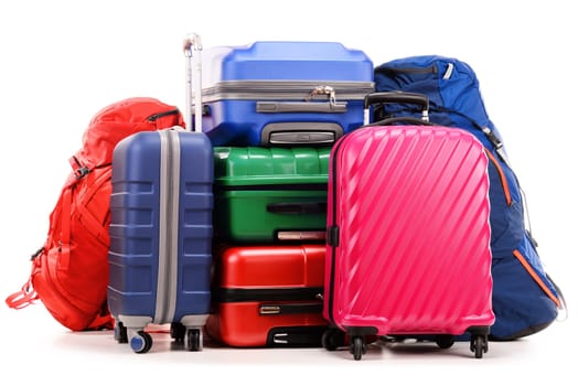 Luggage consisting of large suitcases and rucksack isolated on white.