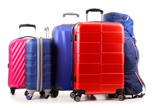 Luggage consisting of large suitcases and rucksack isolated on white.