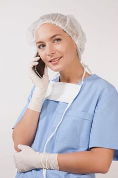 Female nurse talking on a mobile phone