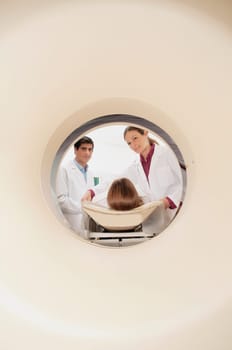 Doctors preparing a patient for MRI scan