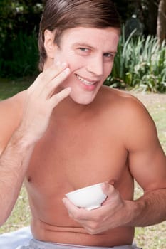 Man applying face pack