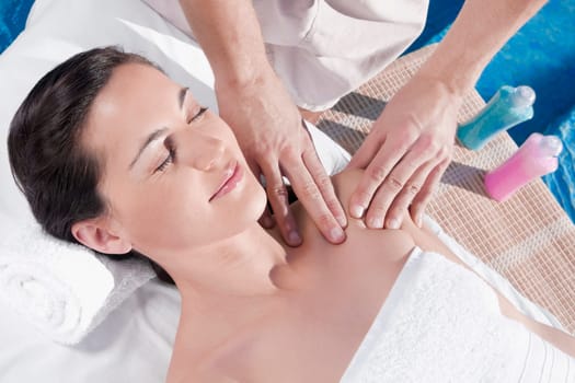Woman receiving massage from a massage therapist