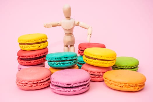 colorful almond cookies  on pink background
