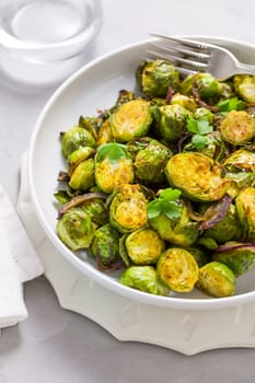 Baked Green Brussels Sprouts with honey and Parmesan cheese.