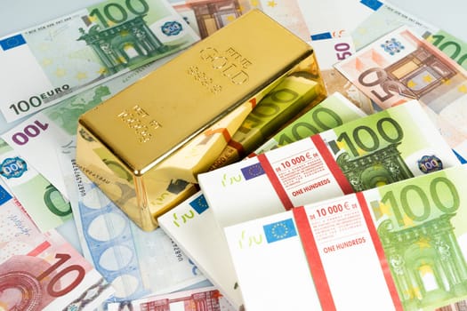 Gold bars and Euro banknotes. Gold bullion and money