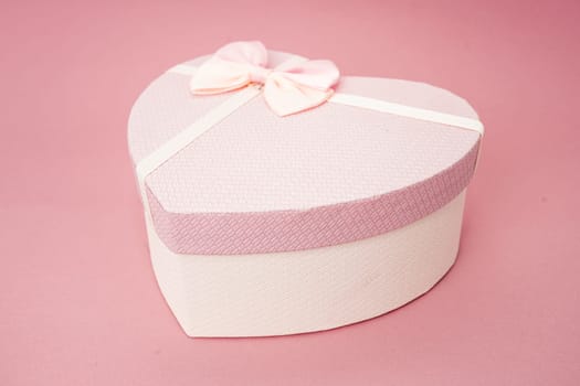 Heart shape gift box on a pink background