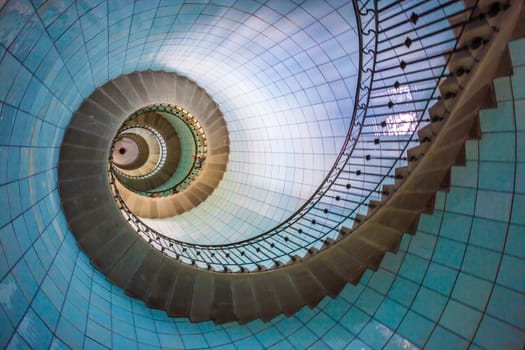 View of high lighthouse blue staircase,  vierge island, brittany,france