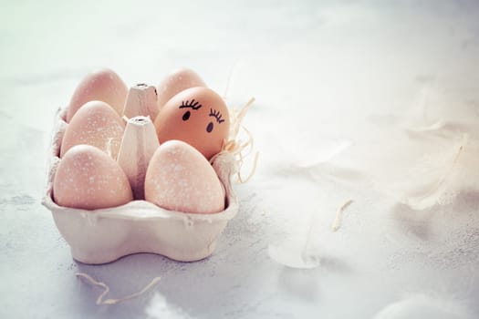 Easter eggs on wooden table. Easter decoration in vintage style with copy space