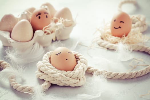 Easter eggs on wooden table. Easter decoration in vintage style