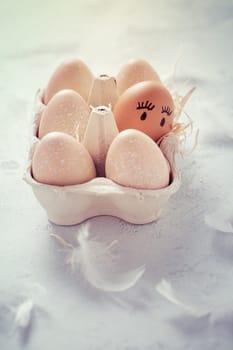 Easter eggs on wooden table. Easter decoration in vintage style with copy space