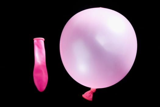 Close_up of a balloon with a deflated balloon