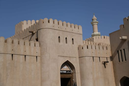 The West Souq by the large fortress Fort Nizwa is located on the edge of the Hajar Mountains in the oasis city in Oman and is very popular with tourists.