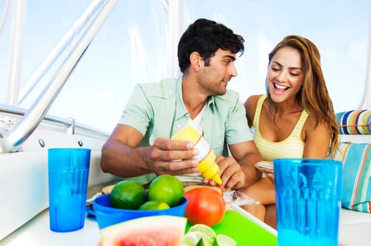 Couple sitting on the ship and having breakfast