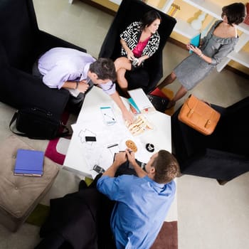 High angle view of business executives discussing
