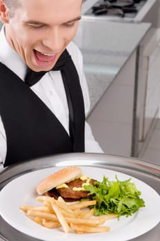 Close_up of a waiter holding a tray of snacks