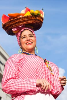 Low angle view of a mature woman selling fruits