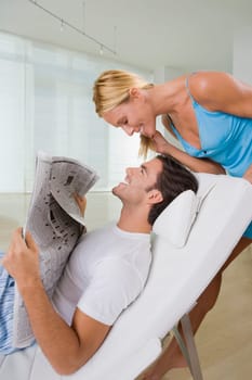 Mid adult woman smiling with a young man