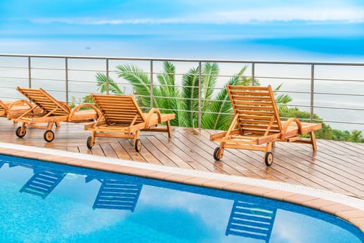swimming pool near luxury villa. Sunny summer vacation