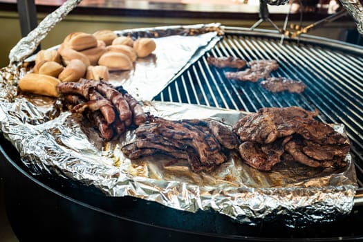 Traditional BBQ barbeque on Christmas market in Germany in Europe