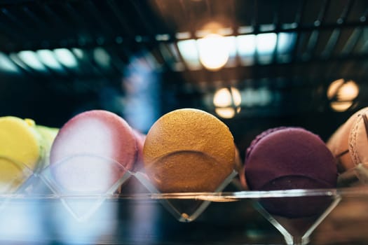 Multicolored macarons on a showcase in a cafe. High quality photo