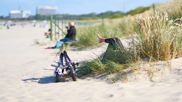 Relaxing on a summer day on the beach of Swinoujscie on the Polish coast of the Baltic Sea