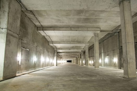 Empty industrial garage room interior with concrete floor and wall background