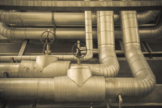 cables and piping as found inside of a thermal power,vintage.color tone