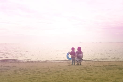 mother and son by on the sea,  color effect