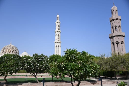 The famous and beautiful Sultan Qaboos Grand Mosque with the main minaret is one of the most important buildings in the Sultanate of Oman.