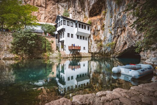 BLAGAJ, BOSNIA AND HERZEGOVINA - SEPTEMBER 10, 2015: Blagaj Tekija was built around 1520, with elements of Ottoman architecture and Mediterranean style and is considered a national monument. Blagaj Tekke is a monastery built for the Dervish.