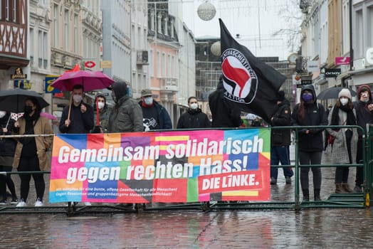 Demonstration in Trier on the 20.01.2021 against the covid-19 regulations in Germany, protest of the Antifa and the radical left wing against corona deniers