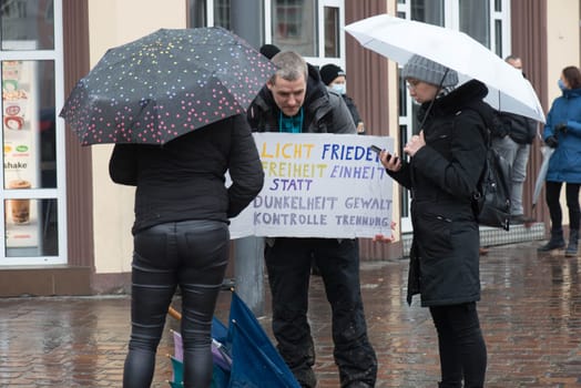 Demonstration in Trier on the 20.01.2021 against the covid-19 regulations in Germany, protest of the Antifa and the radical left wing against corona deniers