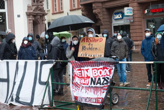 Demonstration in Trier on the 20.01.2021 against the covid-19 regulations in Germany, protest of the Antifa and the radical left wing against corona deniers