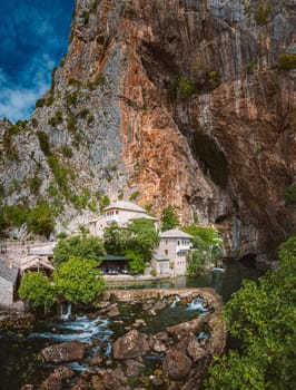 BLAGAJ, BOSNIA AND HERZEGOVINA - SEPTEMBER 10, 2015: Blagaj Tekija was built around 1520, with elements of Ottoman architecture and Mediterranean style and is considered a national monument. Blagaj Tekke is a monastery built for the Dervish.