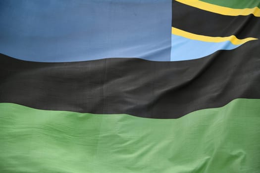 In the wind the national flag,banner of the island of Zanzibar after the union with Tanzania since January 10,2005. The blue represents the Indian Ocean.