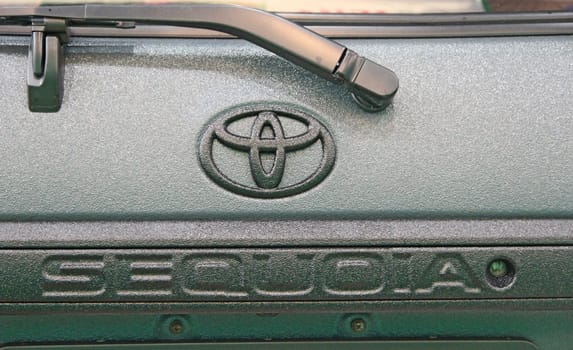 Logo of Toyota Sequoia and windscreen wiper. Modern Toyota car is presented at exhibition in Kiyv. Japanese brand auto Toyota. Sign of Toyota