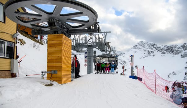 Sochi  Russia - January 02  2021: Skiers climb the cable car at the Krasnaya Polyana ski resort