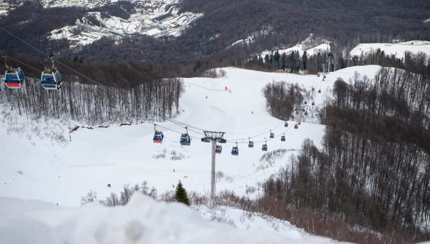 Sochi  Russia - January 02  2021: Skiers climb the cable car at the Krasnaya Polyana ski resort